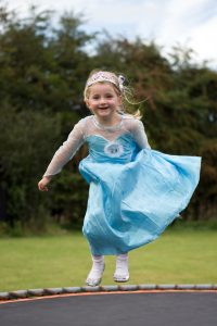 Girl in dress on Trampoline Girl in dress on Trampoline